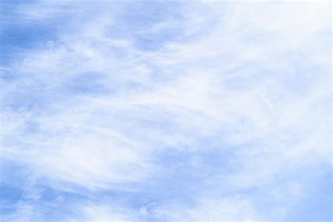 Premium Photo White Clouds In A Bright Blue Sky The Beauty Of The