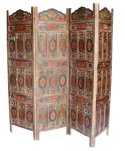 an ornately decorated wooden room divider