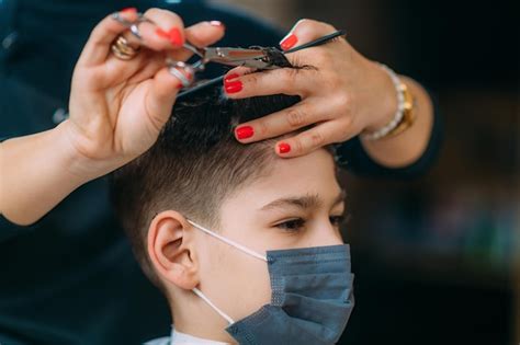 Premium Photo | Hair salon child hair cutting