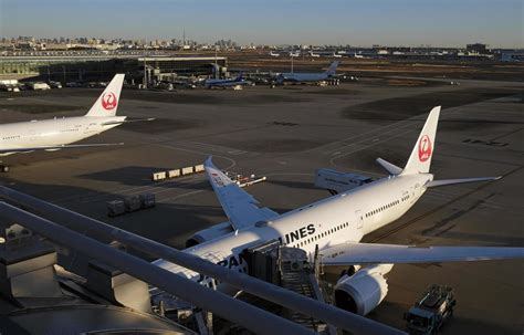 Tokyo, Japan - January 5, 2023 - Planes of Japan Airlines waiting for ...