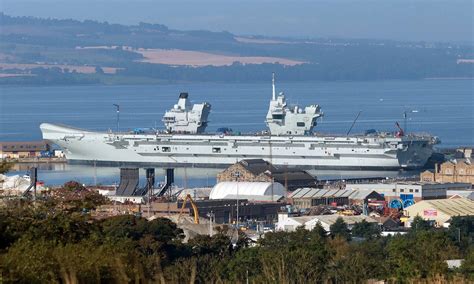 HMS Prince of Wales in Rosyth. Her crew have moved on board and she is loading stores in ...