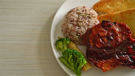 barbecue pork steak with rice berry on white plate 10427164 Stock Video ...