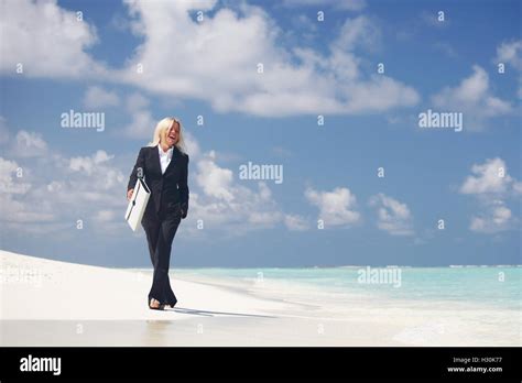 Business Woman With Briefcase Walking On Ocean Beach Stock Photo Alamy