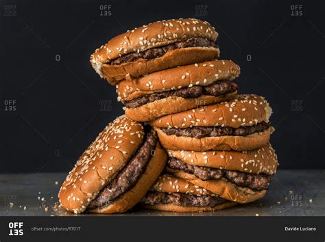 Front view of stacked hamburgers stock photo - OFFSET