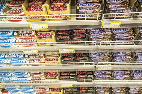 Supermarket Shelves Stacked With Chocolate Bars Snickers Twix Mars