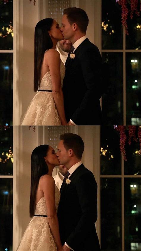 A Couple Kissing Each Other In Front Of A Window