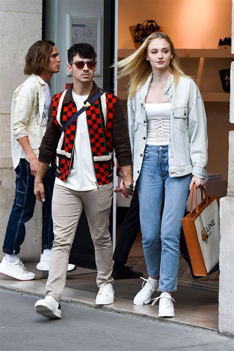 Sophie Turner In Denim Shorts Dior D Connect Sneakers With Joe Jonas Footwear News