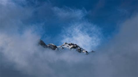 Wallpaper ID: 223135 / wispy clouds frame a snowy mountains crest in ...