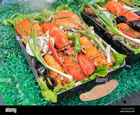 Shellfish Plate Of Crustacean Seafood With Fresh Lobster As An Ocean