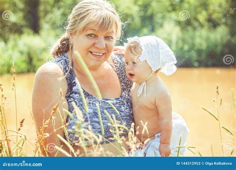 Grandmother With Granddaughter In Her Arms Stock Image Image Of