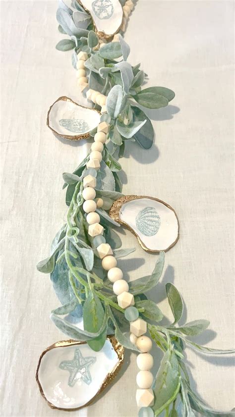 Coastal Dinner Party Sea Glass And Shell Garland Centerpiece Oyster