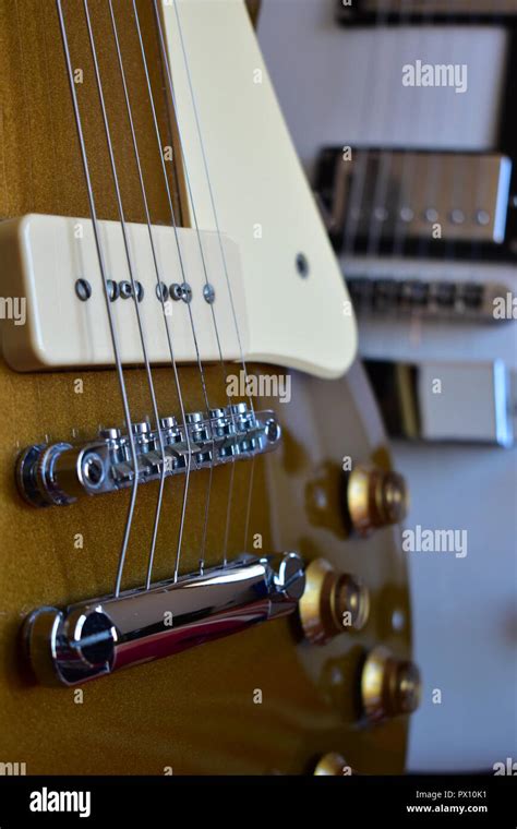 Gold Top And White Electric Guitars Close Up Details Bridge Strings P90 And Humbucker