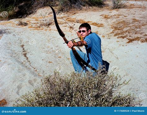 Young Boy Shooting A Bow And Arrow Stock Photo - Image of arrow ...