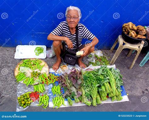 Old Lady In A Market In Cainta Rizal Philippines Selling Fruits And