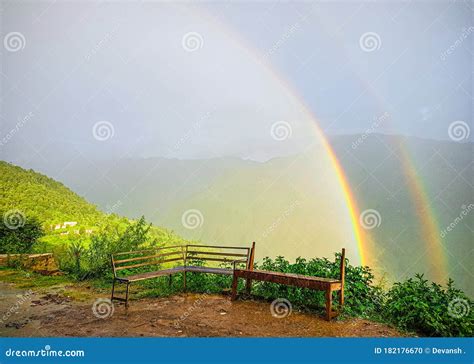 Rainbow Rain Weather Scenery Stock Photo - Image of grass, nature ...