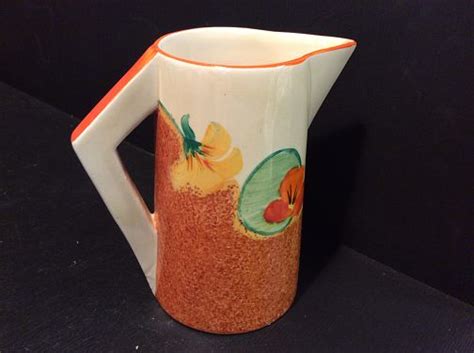 Clarice Cliff An Iconic Art Deco Shaped Conical Jug In The Ever