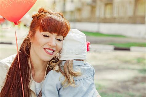 Mom And Daughter Holding A Balloon Stock Image Image Of Funny