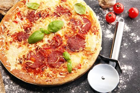 Italian Pizza With Salami Peperoni With Melted Cheese Red Tomatoes