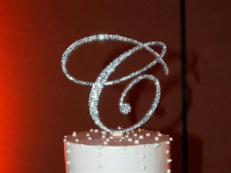 A Wedding Cake With White Frosting And Sparkles