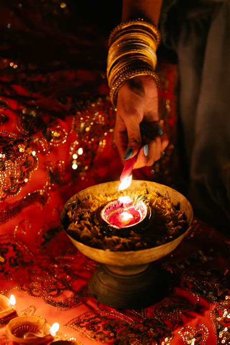 Close-up of Woman Lighting Candle for Ceremony · Free Stock Photo