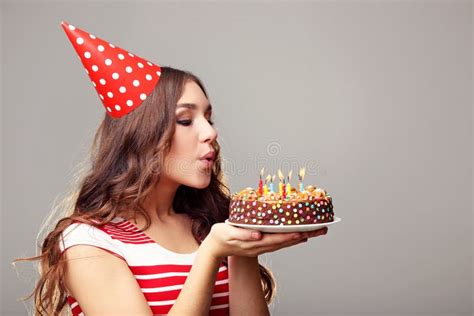 Woman blowing out candles stock photo. Image of candle - 104189688