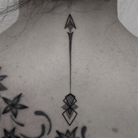 Arrow on the back by Oliver Whiting - Tattoogrid.net