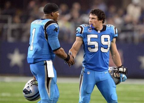 Carolina Panthers Cam Newton And Luke Kuechly Slap Hands