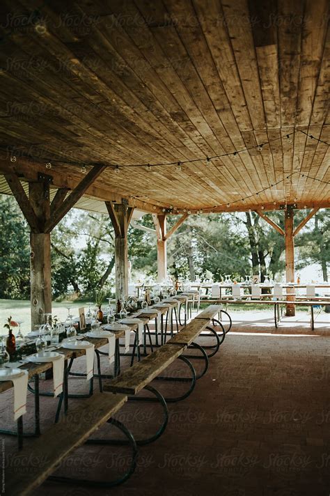 "Outdoor Summer Camp Wedding On Picnic Tables Under Pavilion" by
