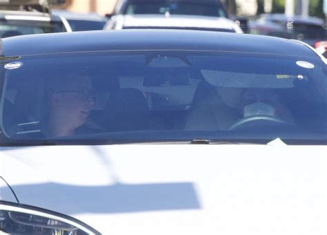 Ariana Grande - Driving Tesla in Los Angeles-08 | GotCeleb