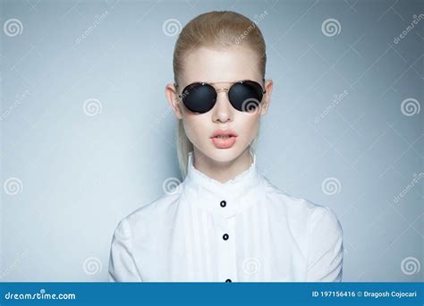 Frontal Portrait Of A Confident Woman With Makeup And Ponytail