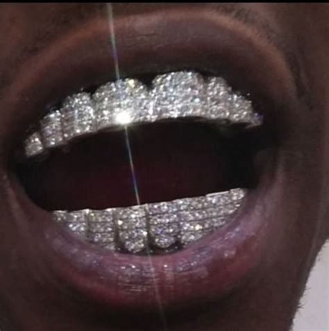 Pin by 🇯🇲Original Haffigaza 🇯🇲 on quavo huncho | Diamond grillz, Teeth ...