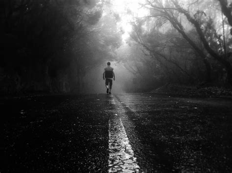 Premium Photo Rear View Of Man Walking On Road During Foggy Weather