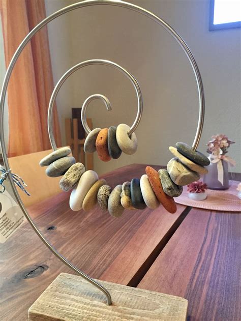 A Wooden Table Topped With Lots Of Different Types Of Rocks On Top Of A