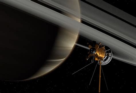 Cassini Probe Zooms Between Saturns Rings And Its Outer Atmosphere