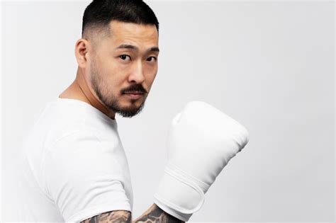 Premium Photo Portrait Of Handsome Serious Asian Man Boxer Wearing