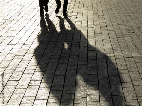 Silhouette Of Couple On The Street Two People Walking On Sidewalk