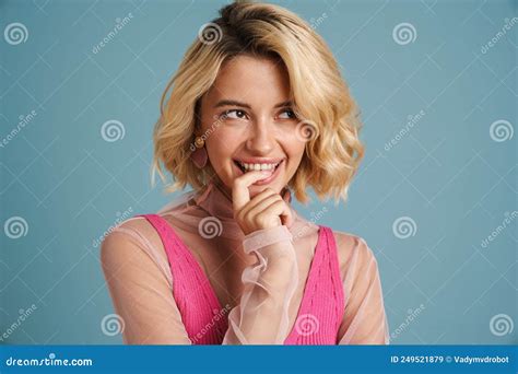 Young White Woman With Blonde Hair Laughing And Looking Aside Stock