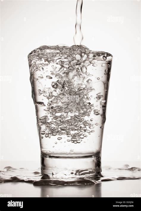 Water Overflowing From Glass Stock Photo Alamy