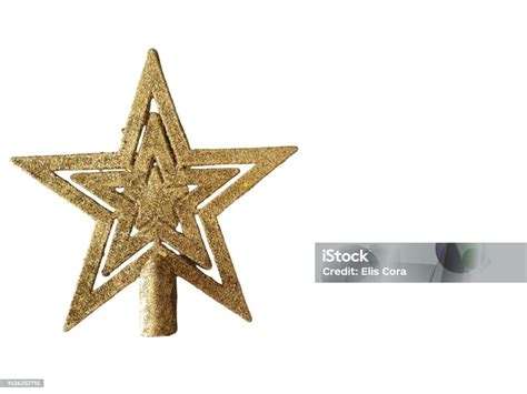 Gold Star To Be Placed On Top Of The Christmas Tree Isolated On A