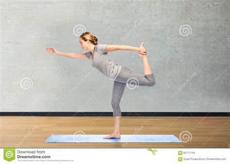 Woman Making Yoga In Lord Of The Dance Pose On Mat Stock Image Image