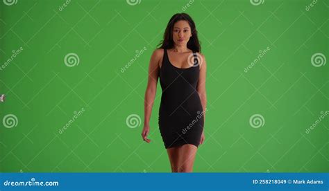 Woman In A Black Dress Walking Toward The Camera In Slow Motion On