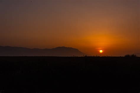 Silhouette of a Mountain during Sunset · Free Stock Photo