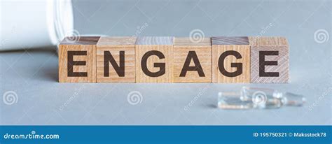 Engage Word Written On Wood Block Front View Engage Text On Grey