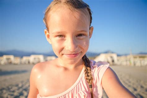 Little Kid Taking Selfie At The Beach During Summer Vacation Stock