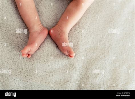 Legs Of New Born Baby Is Sleepin On The Bed Stock Photo Alamy