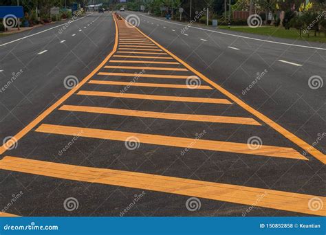 Yellow Line In The Middle Of The Paved Road Stock Photo Image Of