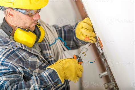 Professional Electrician Working With Cables Stock Photo At