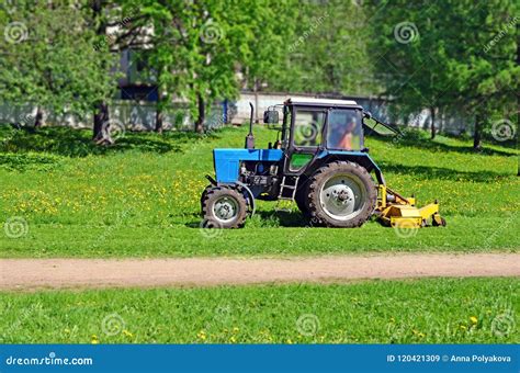 Tractor with Mower Cutting Grass Stock Image - Image of beautiful ...