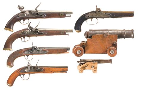 Five Antique Pistols And Two Miniature Cannons A Unmarked Flintlock