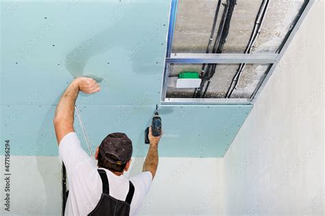 Mater Is Installing A Plasterboard Suspended Ceiling The Assembly